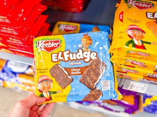 hand holding keebler el fudge cookies in walmart cookie aisle
