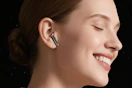 women wearing wireless earbuds