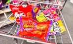 kit kat, reeses, and laffy taffy candy bags in a cart