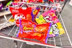 kit kat, reeses, and laffy taffy candy bags in a cart