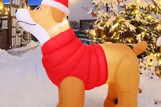 a dog inflatable in a christmas village