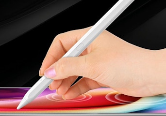 a hand writing on an iPad with a stylus pen 