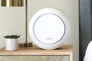 Air Purifier sitting on side table next to bed 