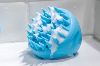 A hair scalp massager in a shower