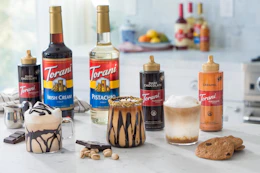 Torani Puremade Sauce next to made coffee drinks