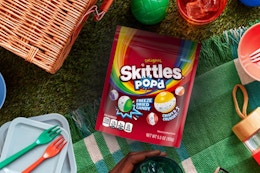 Skittles pop'd in picnic setting