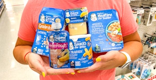 a person holding up geber food at target