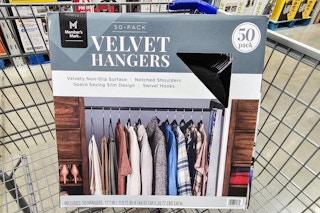 a box of 50 velvet hangers in a cart