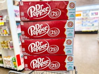 four 12-packs of dr pepper on a shopping cart