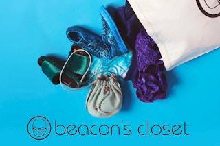 A bag of shoes and accessories spilling out onto a blue background with the Beacon's Closet logo