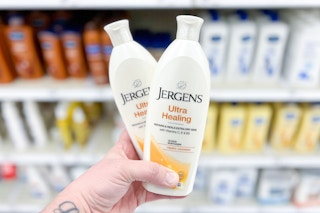 Two Jergens 10 oz Ultra Healing Lotions held up in lotion isle in Target store