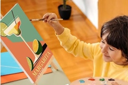 child painting a canvas