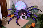 Lifestyle image of an inflatable spider for Halloween