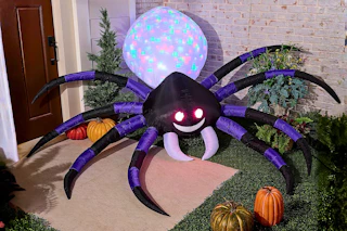 Lifestyle image of an inflatable spider for Halloween