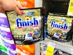 hand holding finish dishwasher tabs in cvs