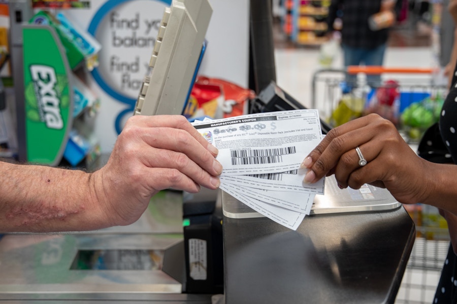 Two holds holding two coupons.