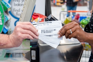 Two holds holding two coupons.