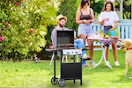 Lifestyle image of the Cowsar 2 burner gas grill in outdoor backyard family setting