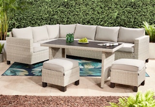 beige sectional with dining table and seats