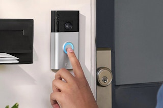 someone pressing on a ring doorbell