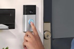 someone pressing on a ring doorbell