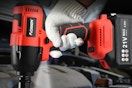 Man holding a Cordless 1/2-Inch Impact Wrench Set.