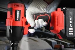 Man holding a Cordless 1/2-Inch Impact Wrench Set.
