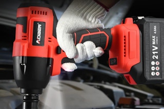 Man holding a Cordless 1/2-Inch Impact Wrench Set.