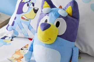 a childs bed with bluey bedding