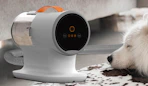 a dog vacuum grooming kit next to a dog