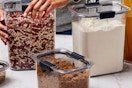 Rubbermaid contains with food in them on a counter.