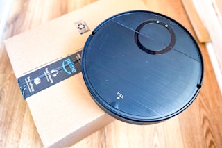 a robot vacuum mop on a floor