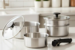 stainless steel cookware set on a kitchen counter