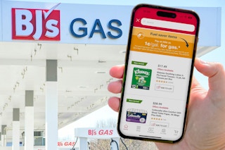 someone holding their phone in front of a BJs gas station, showing the screen for the Penny a Gallon event