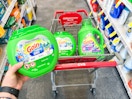 person holding gain flings over a cart with more gain detergent 