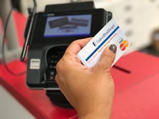 person using their HSA card from United Healthcare