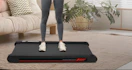 a person standing on a walking pad