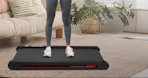 a person standing on a walking pad