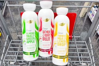3 bottles of dove plant milk body wash in a cart
