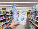 hand holding febreze products in walgreens