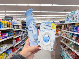 hand holding febreze products in walgreens