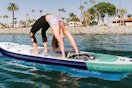 a woman on an inflatable paddleboard