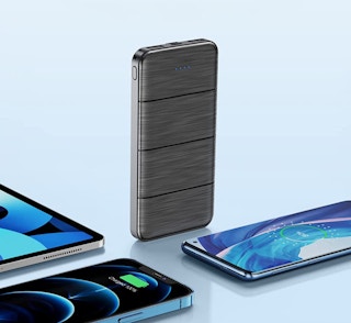 a power bank next to three phones