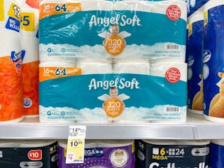 Two Angel Soft toilet paper packages sitting on a store shelf.