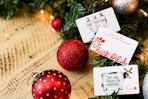 Chick-fil-A gift cards on a table with Christmas decorations