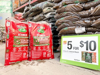 bags of home depot colored mulch with sign showing five for $10