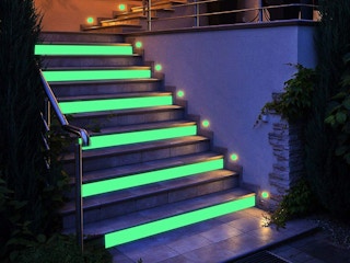 A staircase decorated with glow in the dark tape.