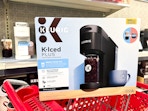 target k-iced plus coffee maker sitting on a target cart