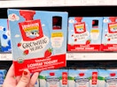 A hand holding a box of Horizon Organic Growing Years Lowfat Yogurt at Target