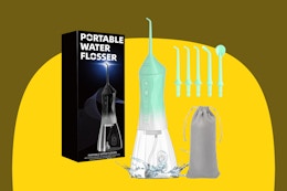 Portable water flosser with five interchangeable attachments and a drawstring carrying bag